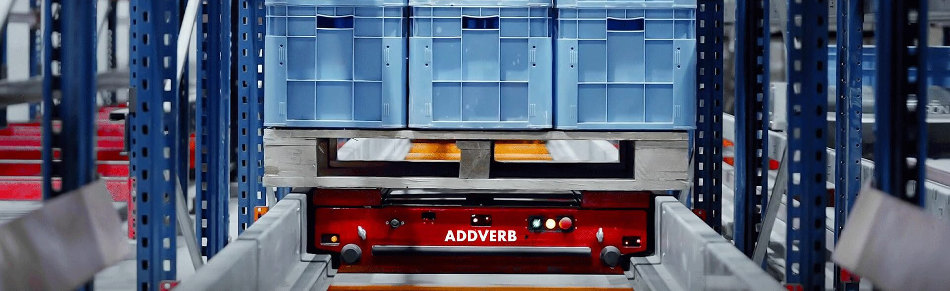 pallet-shuttle-cruiser-with-pallets-addverb.png Pallet shuttle sits inside racking system ready to put away palletized goods